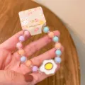 Cute jelly color beaded bracelet detail shot, perfect for kids and girls summer daily wear. - Cartoon Fried Egg