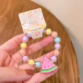 Cute children colorful bead bracelet with watermelon pendant detail view, lovely summer jewelry. - Cartoon Watermelon