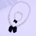 Kids white pearl necklace and bracelet set with cute black bowknot sweet fashion jewelry. - 2-Piece Set (Transparent Bag) / Black