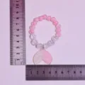 Kids beaded bracelet with cute mermaid tail pendant, pink and clear crystal beads detail view. - White-Pink Gradient Mermaid Tail Bracelet