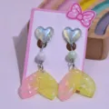 Children cute clip-on earrings with colorful resin heart and glitter mermaid tail pendant. - Pink and Yellow Heart Fishtail Earrings 1 Pair (With Card)