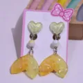 Cute kids clip-on earrings with glittery yellow fish tail and heart design for girls. - Yellow Heart Fishtail Earrings 1 Pair [With Card]