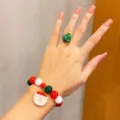 Adorable Christmas bracelet and ring set for kids with cute Santa pendant and tree ring. - Santa Claus 2-Piece Set