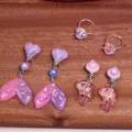 Kids clip-on earrings set featuring cute mermaid tails, dolphins and sparkling gemstone rings. - 6-Piece Clear Bag Set / Pink Purple