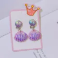 Detailed view of cute children clip-on earrings with purple iridescent seashell pendants. - Gradient Purple Shell