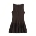 Detail view of dark brown sleeveless short dress featuring a back zipper and pleated hem design. - Brown