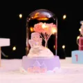 Close-up detail of the cute fairy glass dome night light with warm LED star lights. - Fairy (1018-7) / Starry Light Series / Purple Cherry Blossom Light