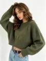 Detailed view of cozy knit texture and relaxed fit of the stylish cropped green sweater. - One Size / Army Green