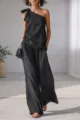 Black one-shoulder sleeveless top featuring elegant tie detail paired with chic wide-leg pants. - S / Black
