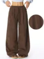 Brown corduroy wide-leg pants featuring a high waist, drawstring, and stylish drape look. - S / Blue