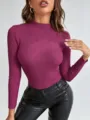 Detail view of the magenta ribbed mock neck sweater, showing the texture and slim fit design. - One Size / Purple