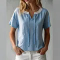Light blue short-sleeve top featuring a white lace V-neckline with delicate ties for women. - S / Sky Blue