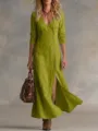 Close-up detail of the green linen long-sleeve maxi dress showing elegant button closure. - S / Yellow-Green