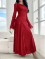 Details of the elegant red long sleeve slim trumpet dress with ruched design in bright room. - XS / Red