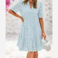 Close up detail of light blue eyelet embroidered tiered dress short sleeve V-neck summer casual style. - Light Blue