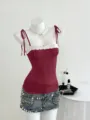 Detailed view of the elegant burgundy camisole with white lace trim and cute bow strap design. - XL / Tops / Burgundy