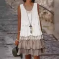 Detail view of women sleeveless lace patchwork dress, stylish casual ruffle skirt design. - S / Dresses / White
