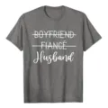 Close up of graphic t-shirt featuring boyfriend fiance husband text print for men casual wear. - S / Tops / Dark Gray