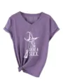 Detail of women purple V-neck short sleeve t-shirt with cute witch hat print graphic front. - Purple