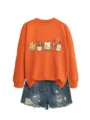 Felpa arancione a maniche lunghe con simpatica stampa artistica e pantaloncini di jeans. - Taglia S / Top / Arancione