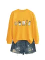 Felpa gialla a maniche lunghe girocollo con grafica d'arte carina e pantaloncini in denim. - Taglia S / Top / Giallo