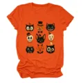 Close-up detail of retro Halloween graphic print on orange short-sleeve crewneck t-shirt. - S / Tops / Orange