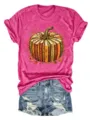 Nahaufnahme der herbstlichen Kürbis-Buch-Grafik auf dem bequemen rosa Kurzarm-T-Shirt-Stoff. - Fuchsia