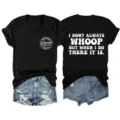 Close up details of black v-neck t-shirt featuring front chest and back white slogan print. - S / Tops / Black