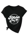 V-neck short sleeve graphic tee detail, side knot design, tropical print close-up. - Black