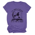 Detailed close-up view showing the literary witch graphic print on the soft purple fabric. - S / Tops / Purple (Black Text)