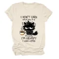 Casual women's short sleeve crewneck t-shirt featuring a funny grumpy black cat print. - S / Tops / Sand (Black Text)