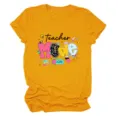 Close-up view of the yellow teacher graphic t-shirt chest print and soft fabric details. - S / Tops / Mustard Yellow (Black Letters)