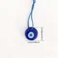 Gedetailleerd overzicht Turks boze oog glas hanger, blauw amulet geluksbrenger decoratie. - Rond
