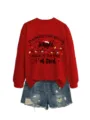 Detailed view of the red holiday graphic sweatshirt paired with distressed denim shorts. - S / Black Graphic Style (Top) / Red