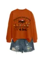 Detailed view of the orange Christmas themed graphic sweatshirt featuring fun holiday quotes. - S / Black Graphic Style (Top) / Burnt Orange