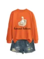 Detailed view of orange long-sleeve sweatshirt featuring cute duck graphic and letter print. - S / Tops / Orange
