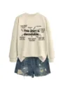 Detailed view of the casual long-sleeve beige sweatshirt featuring educational English text. - S / Tops / Sand Sweatshirt (Black Font)