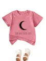 Pink cotton toddler t-shirt featuring a stylish crescent moon and graphic text detail. - Peach