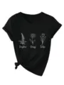 Detailopname van het zwarte V-hals t-shirt met korte mouwen en leuke bloemenprint. - Zwart