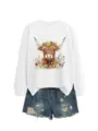 Detailed view of the white sweatshirt featuring a cute floral highland cow graphic print. - S / Tops / White