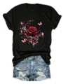 Close-up detail of black short-sleeve tee with gothic rose and butterfly moon graphic print. - S / Tops / Black