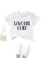 White kids short sleeve t-shirt with chic letter print, styled with pearl bag and sneakers. - 90 / Tops / White
