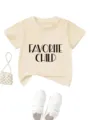 Detail shot of beige kids short sleeve t-shirt with letter print, casual cotton child top. - Apricot