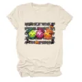 Casual women's round neck short sleeve T-shirt featuring a cute Halloween dumpling and pumpkin graphic design. - S / Tops / Sand
