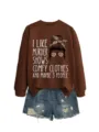 Casual brown sweatshirt with graphic print paired with distressed denim shorts for women. - S / Tops / Coffee Sweatshirt (White Text Pattern)