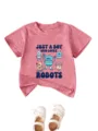 Close-up detail of the cute cartoon robot graphic printed on the soft pink toddler t-shirt. - Peach