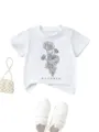 Detail view of white children t-shirt featuring elegant floral line art and october text. - 90cm / Tops / White