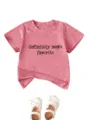 Close-up detail of the casual kids short-sleeve pink t-shirt with lovely quote print. - Peach