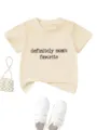 Detail view of a beige kids short sleeve t-shirt featuring fun letter print design. - Apricot