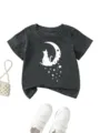 Detail shot of kids short sleeve t-shirt featuring cat moon graphic on dark gray fabric. - 90cm / Tops / Dark Gray